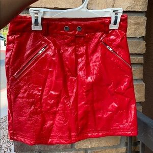 Fire engine red skin tight leather miniskirt